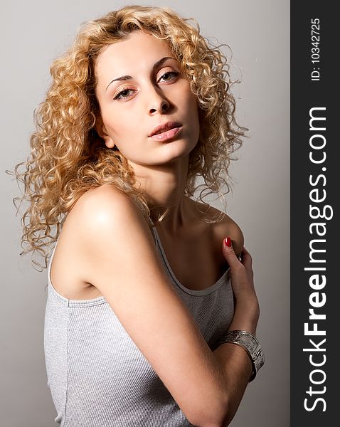 Closeup portrait of young blond curly hair woman