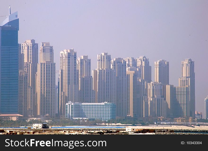 A view of some of the towers of JBR in Dubai from the Palm Jumeirah Trunk. A view of some of the towers of JBR in Dubai from the Palm Jumeirah Trunk