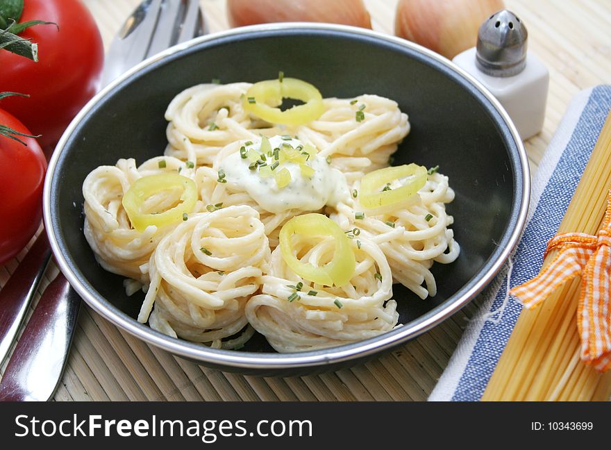 Fresh italian pasta with cheese-sauce and paprika