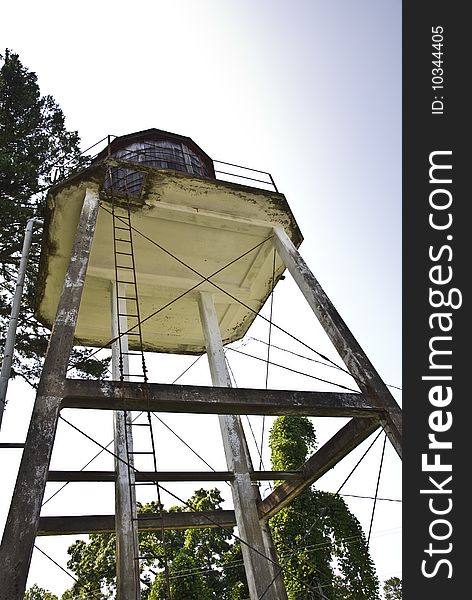 An abandoned water tower from below. An abandoned water tower from below.