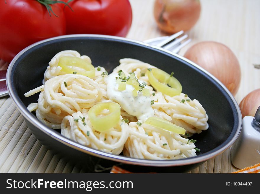 Fresh italian pasta with cheese sauce and peppers. Fresh italian pasta with cheese sauce and peppers