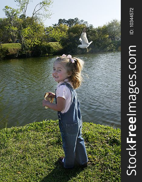 C - Small Girl Feeding Birds 2