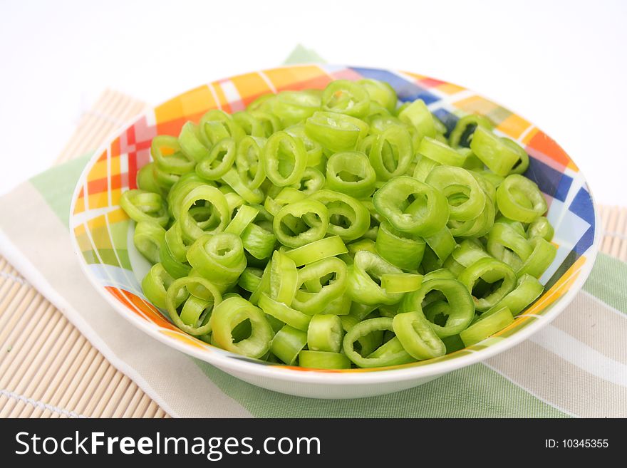 Some green paprika in a colourful bowl