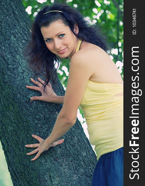 Pretty brown-haired typical russian girl near tree (CROSSPROCESSED). Pretty brown-haired typical russian girl near tree (CROSSPROCESSED)