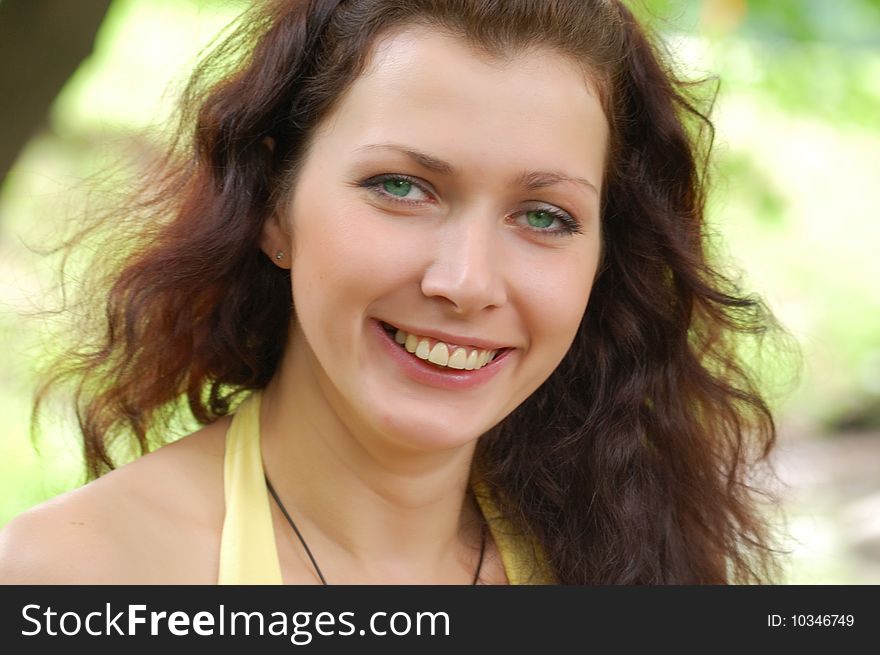 Pretty brown-haired typical russian girl with water on background. Pretty brown-haired typical russian girl with water on background