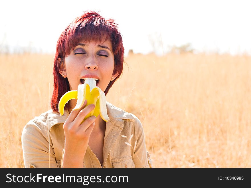 Woman enjoys a banana fruit. Woman enjoys a banana fruit