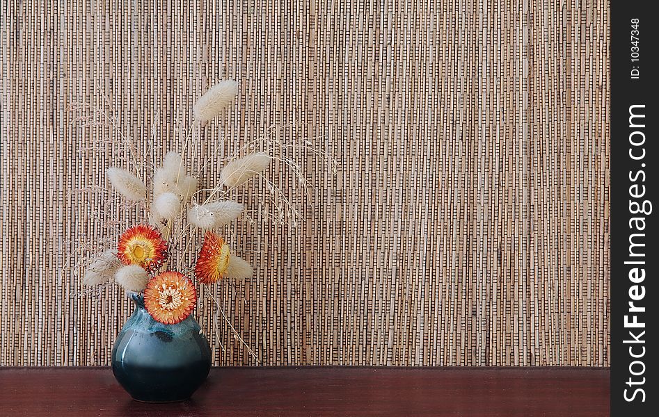 Ikebana on brown natural background