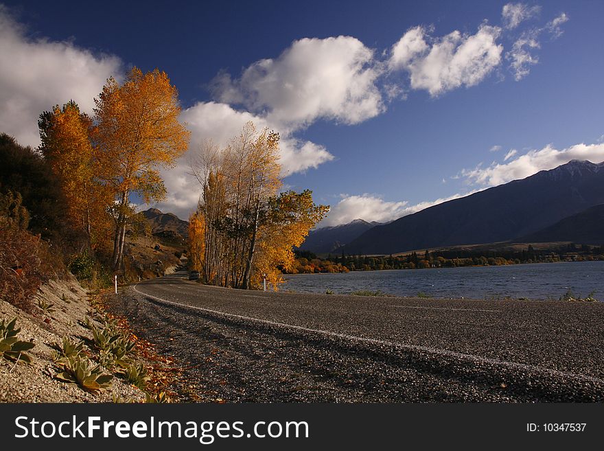New zealand autumn scenery with winding road. New zealand autumn scenery with winding road