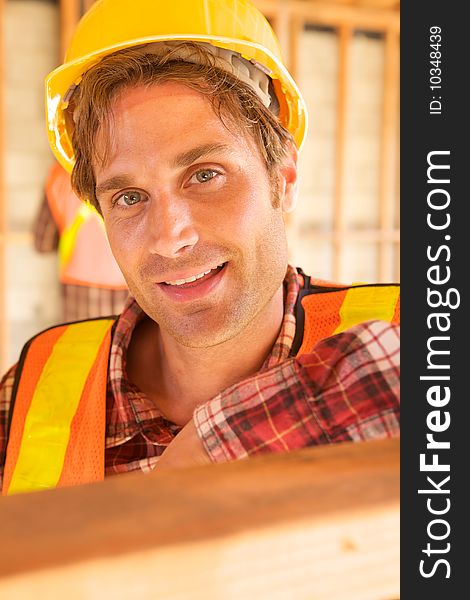 A closeup of a construction worker with a hard hat. A closeup of a construction worker with a hard hat
