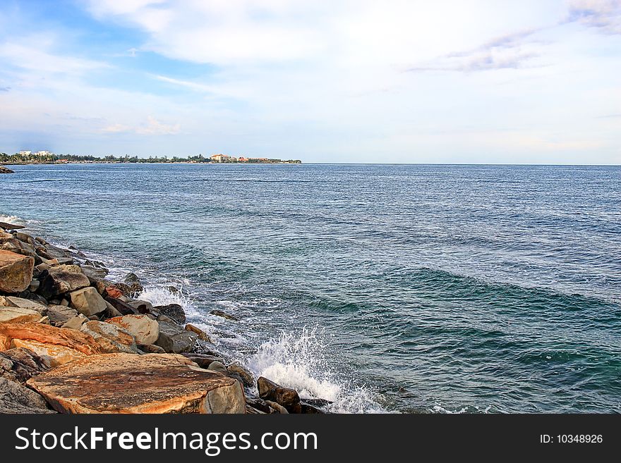 View of the beach on cloudy sunny day.