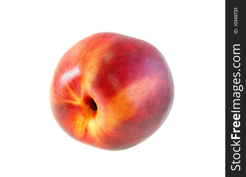 The ripe red peach on a white background, is isolated.