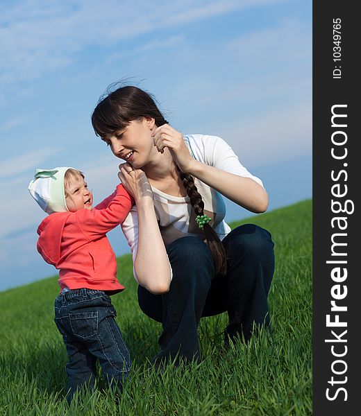 Portrait of a little girl with mom outdoors