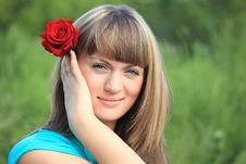 Girl With Red Rose In Hair Stock Photo