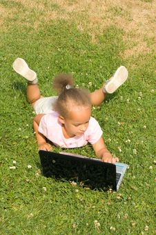 Beautiful Young Mixed Race Girl Using Laptop Royalty Free Stock Image