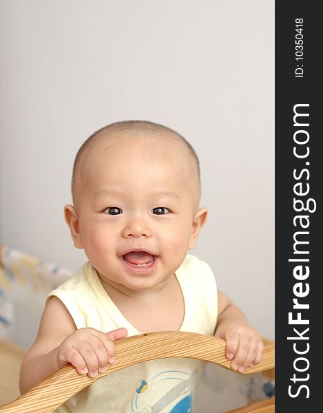 It is a cute chinese baby, he is 7 months, and has 2 little teeth. It is a cute chinese baby, he is 7 months, and has 2 little teeth.
