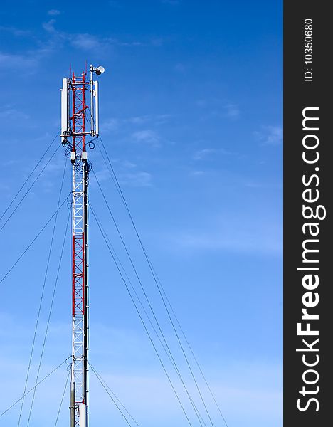 Telecommunication tower on a sky background