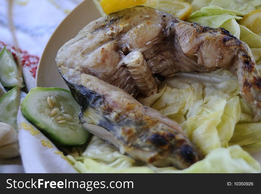 Close up with healthy fish, sheatfish, with lemon
