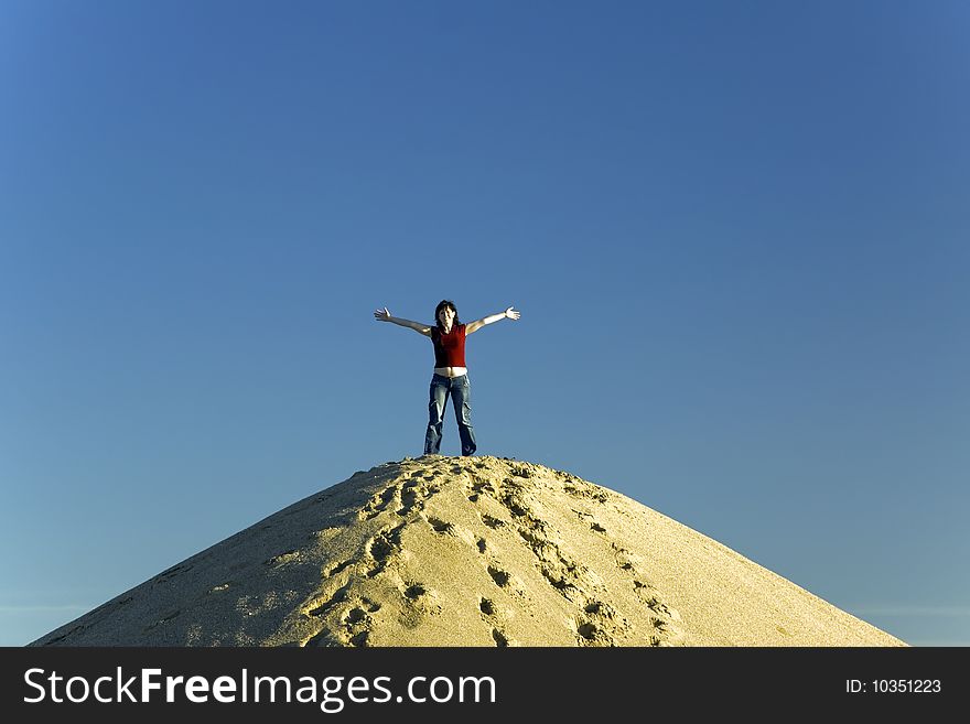 with hands up at blue sky as background. with hands up at blue sky as background