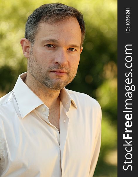 Portrait of fashion man in a park