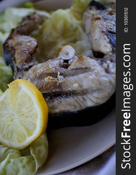 Close up with healthy fish, sheatfish, with lemon