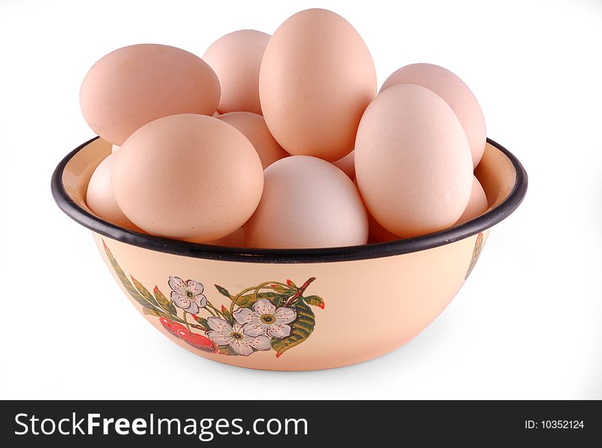 Chicken eggs are in a dish