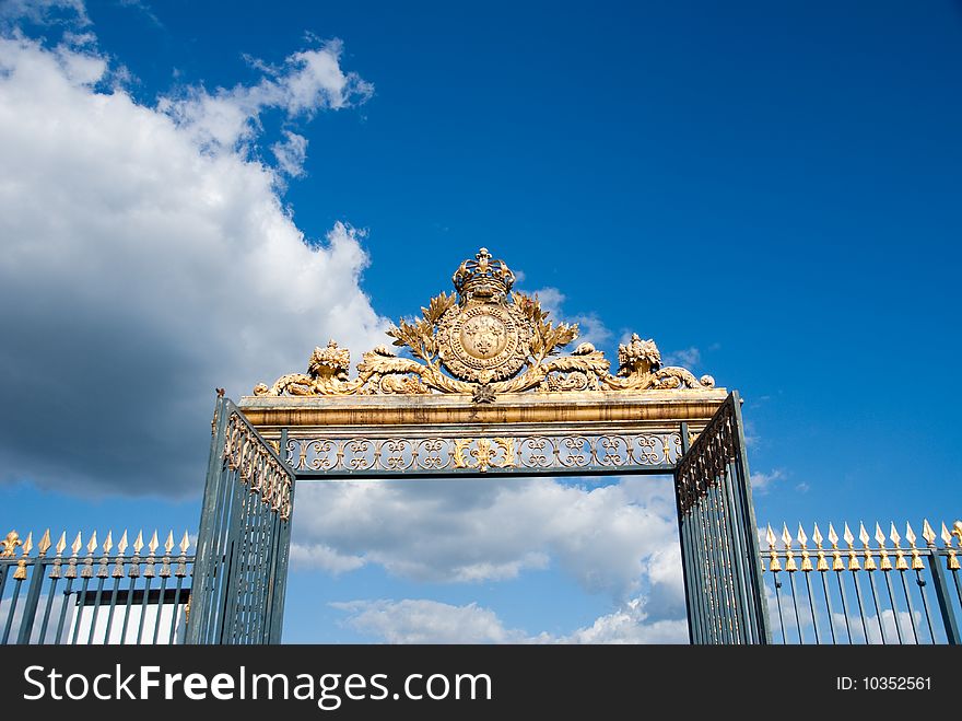 Golden Gate against blue sky in Paris Palace