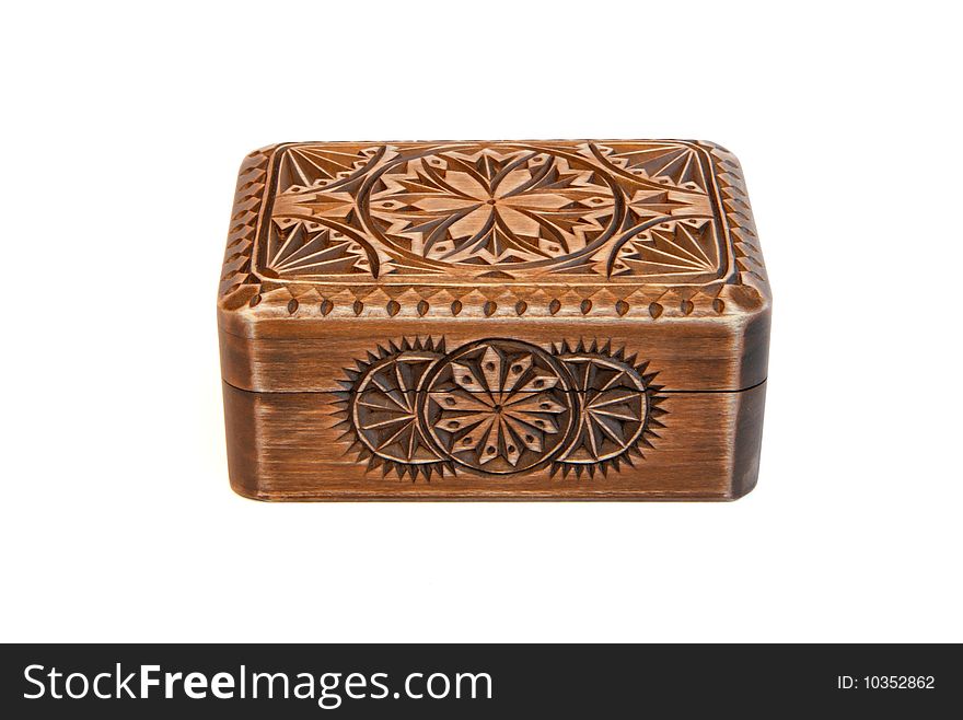 Closed carved wooden casket isolated