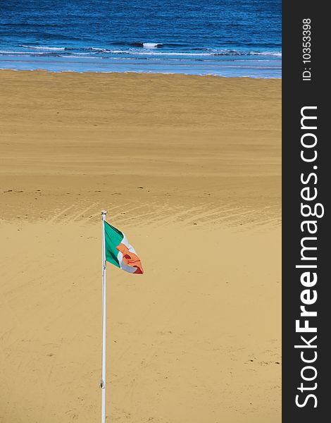 A view of the beach in ballybunion co kerry ireland with irish flag. A view of the beach in ballybunion co kerry ireland with irish flag