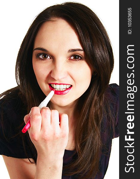 Woman about to apply lipstick to her lips