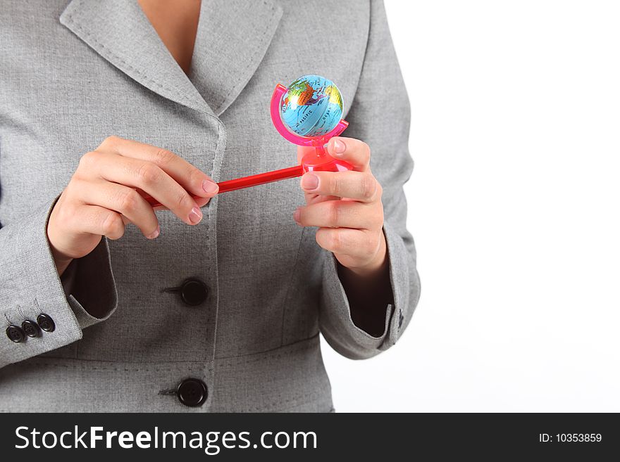 Woman's hands with small globe pencil sharpener