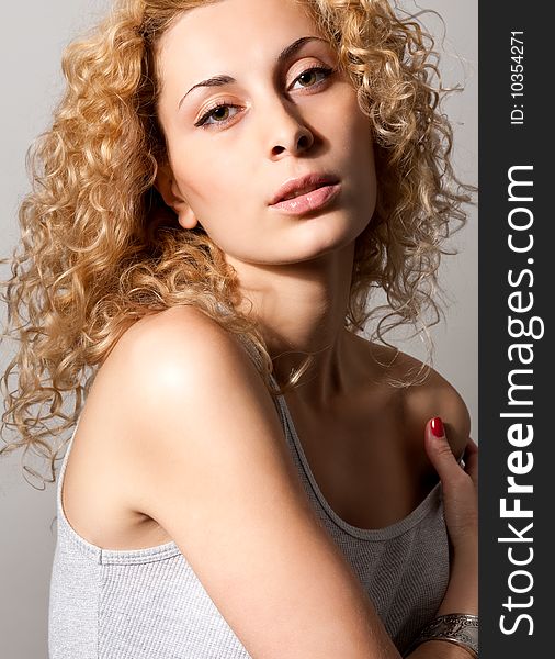 Closeup portrait of young blond curly hair woman