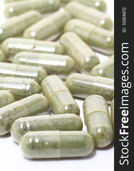 Green Pills on white background