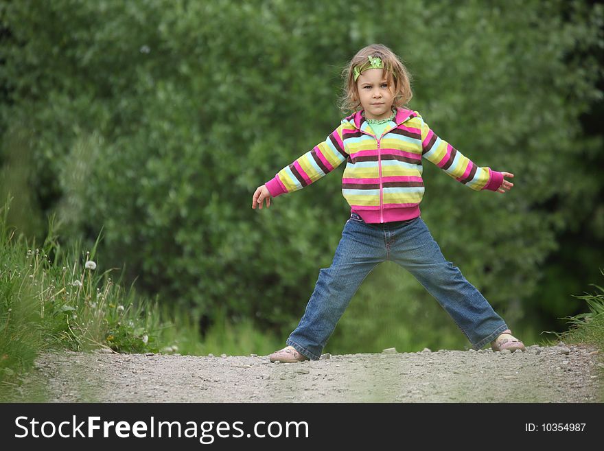 Girl makes gymnastic in park