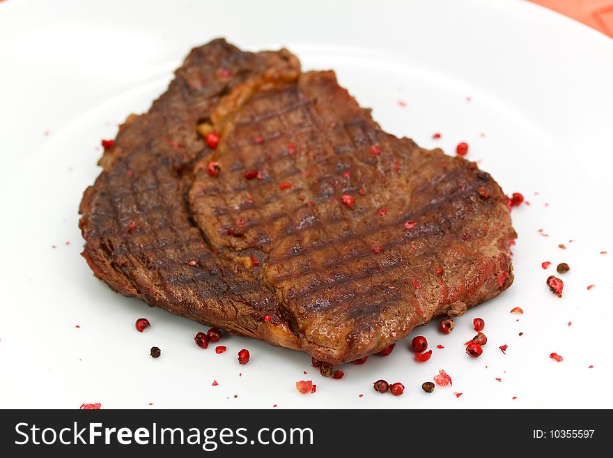 Rib Eye Steak On The White Plate