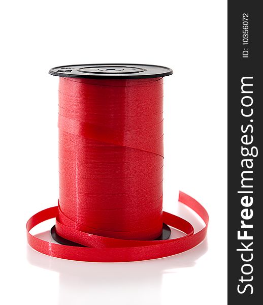 Roll of red ribbon isolated on white