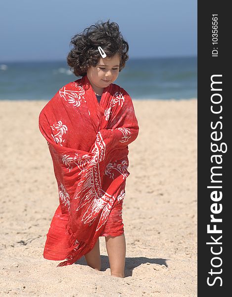 A cute little girl on the beach