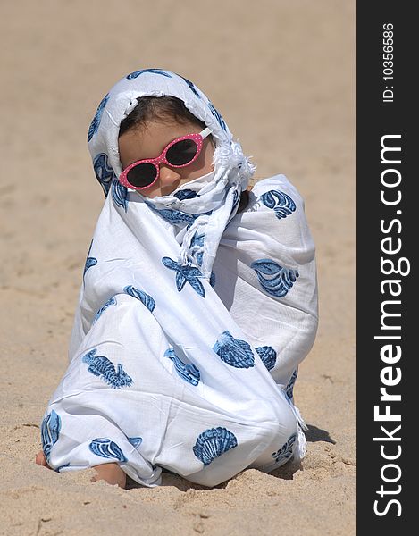 A cute little girl on the beach