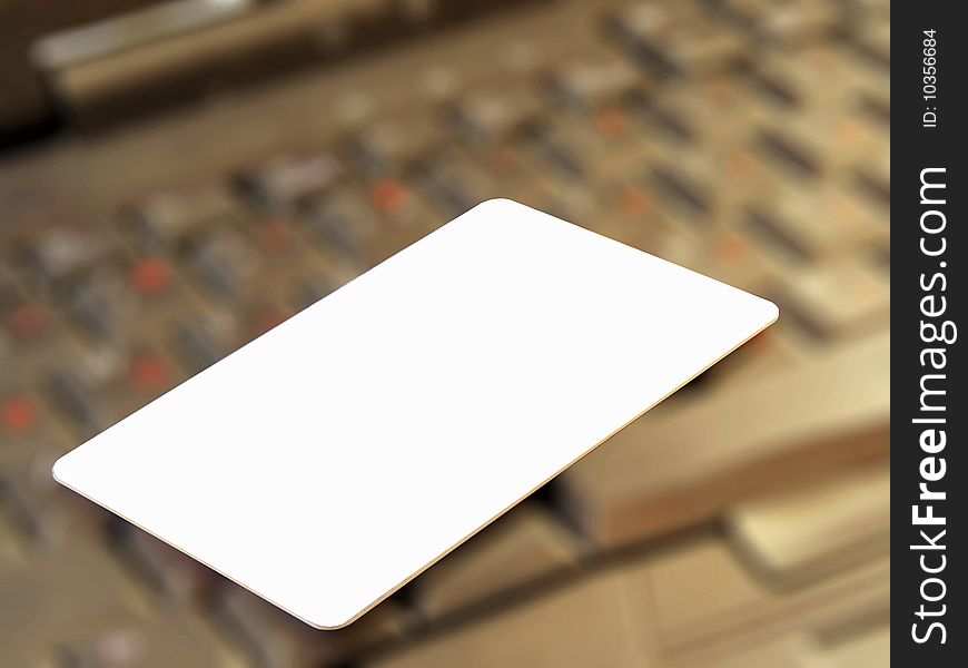 Blank credit card against a keyboard.