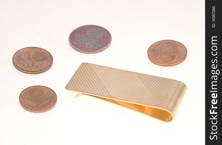 Empty money clip with five, two and one euro cent coins over a white background. Empty money clip with five, two and one euro cent coins over a white background.
