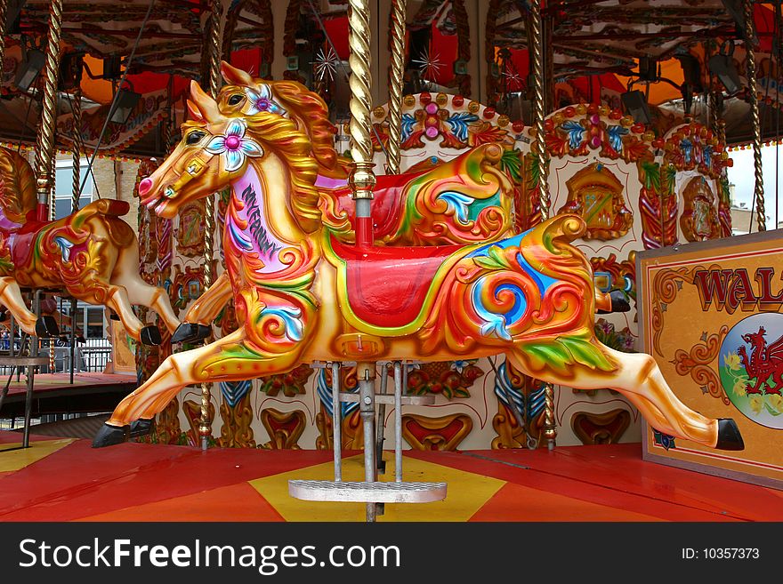 Brightly colored horses of carousel. Brightly colored horses of carousel