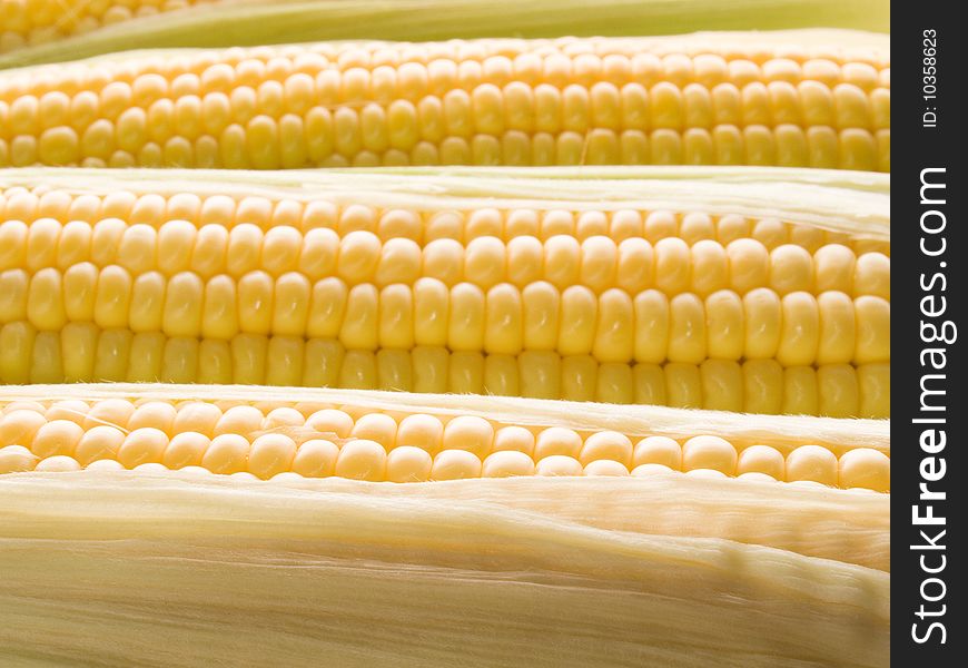 Raw yellow corn closeup background. Raw yellow corn closeup background.