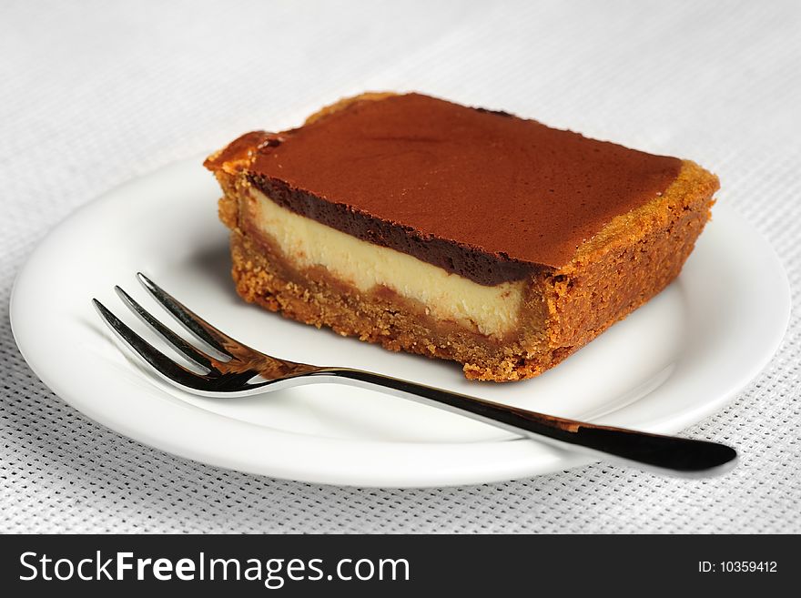 Chocolate souffle cake at the saucer with dessert fork