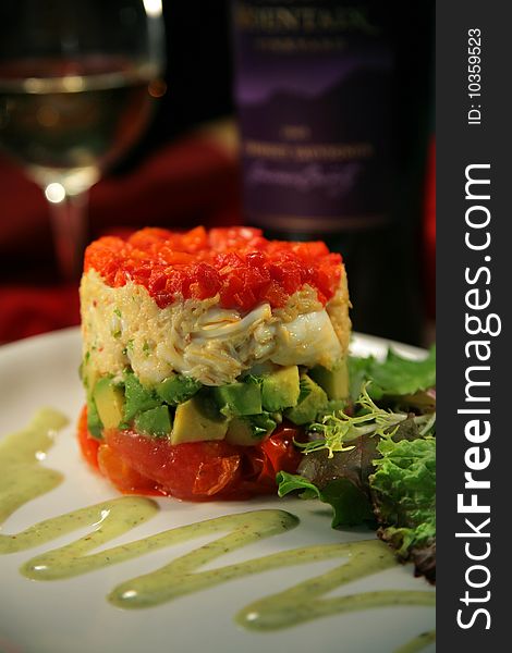 Tuna Stack with raw tuna, crab, avocado, avaocado sauce, lettuce, white wine.