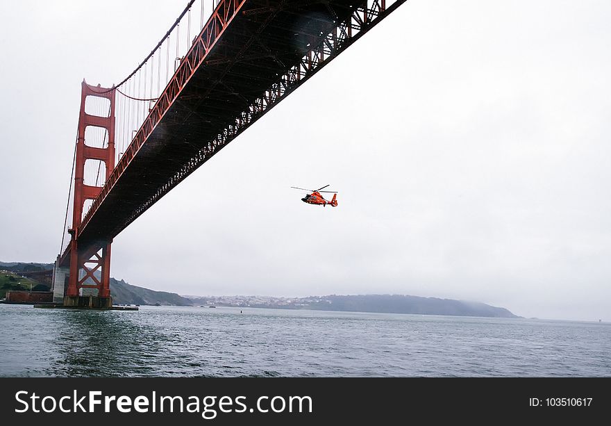 Rescue Helicopter Flying Under Golden Gate Bridge