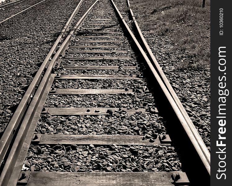 Perspective of a railroad track in black and white. Perspective of a railroad track in black and white.