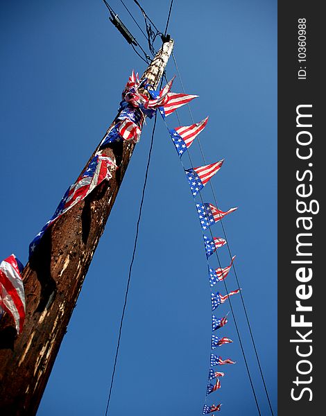 Decorative American flags on telephone pole. Decorative American flags on telephone pole