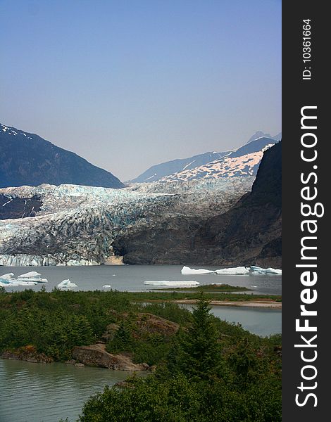 View of the Mendenhall glacier, with ice floes in Mendenhall lake. View of the Mendenhall glacier, with ice floes in Mendenhall lake