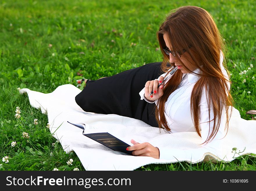 Beautiful Young Woman Studing In Park