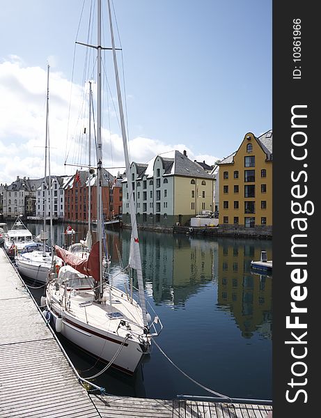 Boats in a river near buildings in Norway