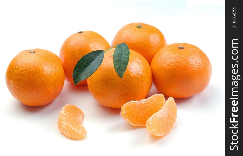 Clementines with segments on a white background